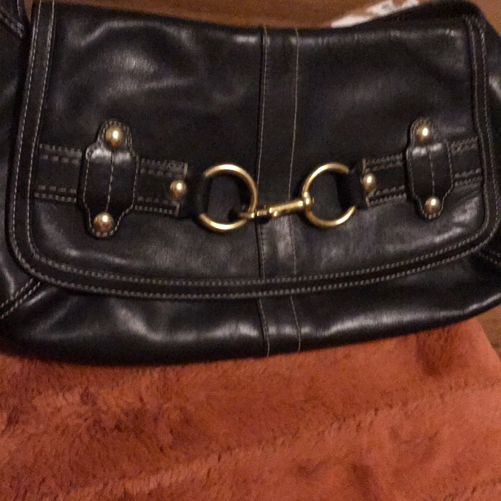 Black leather Coach purse with gold buckle